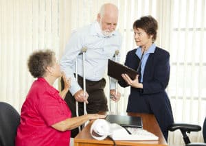 An elderly couple speak to a Richmond slip and fall lawyer.