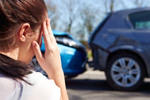 A woamn is distraught after an accident with an uninsured motorist in Virginia