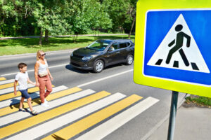 Mother and son crossing the street.