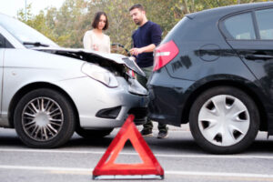 Drivers involved in the accident exchanging contact number.