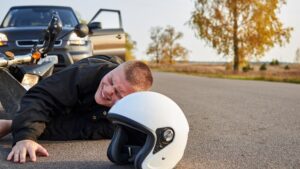 Motorcycle rider fell down from accident.