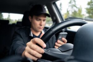 Driver texting while driving.