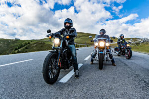 Group of motorcycle riders in the road