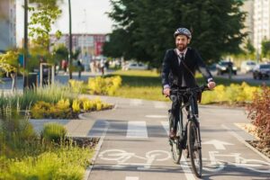 Cyclist wearing helmet enjoying the ride.