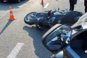 Motorcycle fell on the ground from accident.