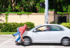 Driver is texting while driving causing accident to pedestrian.